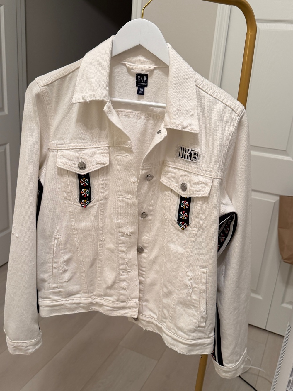Reconstructed white denim jacket made with Nike pinwheel track pants